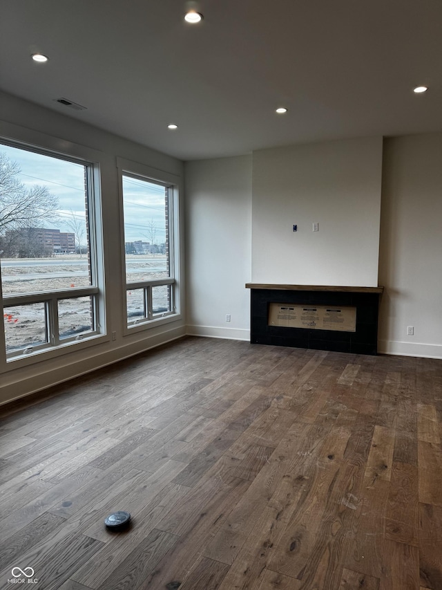 unfurnished living room with hardwood / wood-style flooring