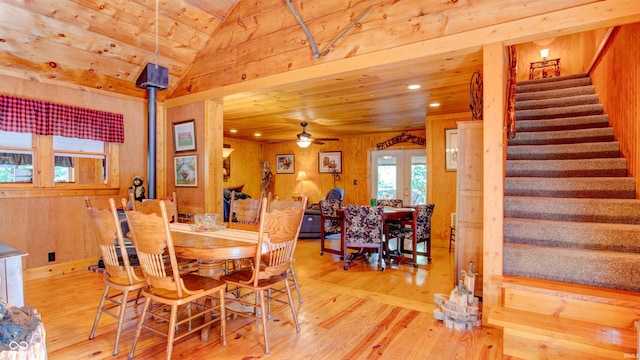 dining room with wood ceiling, ceiling fan, light wood-type flooring, and vaulted ceiling