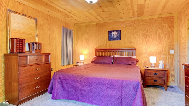 carpeted bedroom with wooden walls and wood ceiling