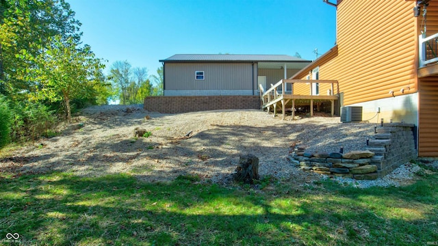 back of house featuring cooling unit