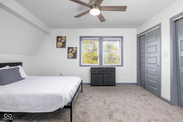 2221 E Michigan St, Indianapolis, IN 46201 - bedroom with baseboards, a ceiling fan, carpet, and vaulted ceiling