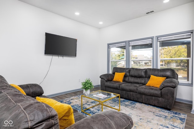 2221 E Michigan St, Indianapolis, IN 46201 - living area featuring recessed lighting, visible vents, wood finished floors, and baseboards
