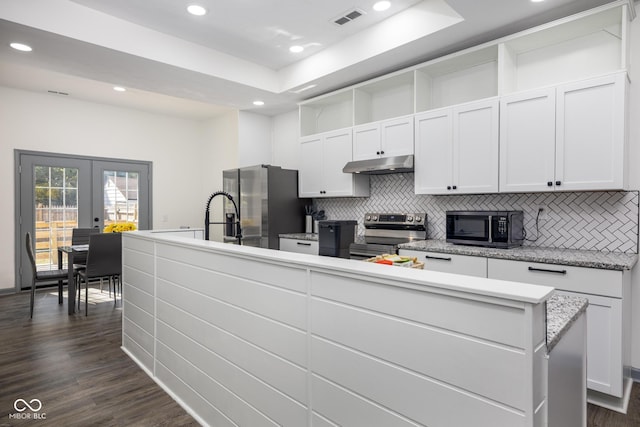 2221 E Michigan St, Indianapolis, IN 46201 - kitchen featuring recessed lighting, stainless steel appliances, under cabinet range hood, visible vents, and french doors