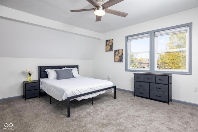 2221 E Michigan St, Indianapolis, IN 46201 - bedroom with a ceiling fan, baseboards, vaulted ceiling, and light carpet