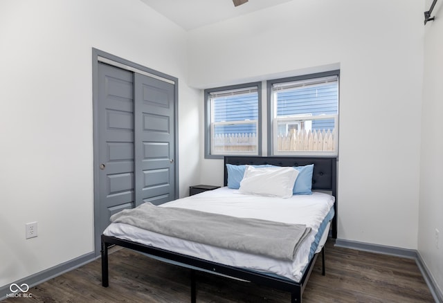2221 E Michigan St, Indianapolis, IN 46201 - bedroom featuring wood finished floors, baseboards, and a closet