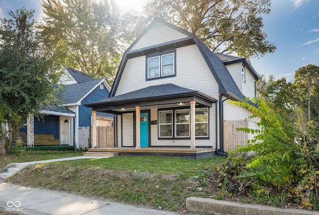 view of front of house with a front lawn and covered porch