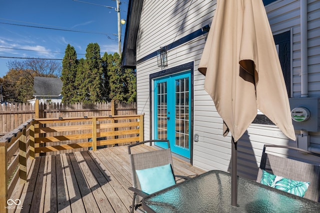 2221 E Michigan St, Indianapolis, IN 46201 - wooden deck featuring outdoor dining area, french doors, and fence