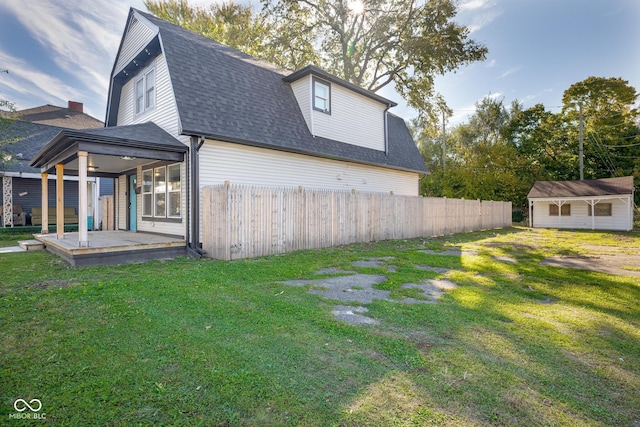2221 E Michigan St, Indianapolis, IN 46201 - exterior space featuring fence, a yard, and roof with shingles