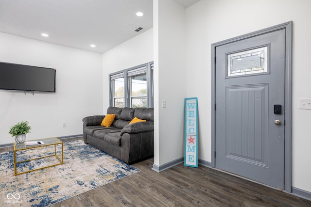 2221 E Michigan St, Indianapolis, IN 46201 - living area featuring dark wood-style floors, recessed lighting, visible vents, and baseboards