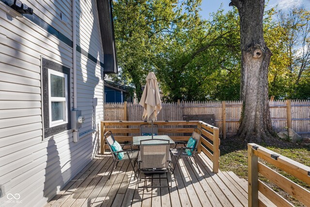 2221 E Michigan St, Indianapolis, IN 46201 - deck with a fenced backyard and outdoor dining area