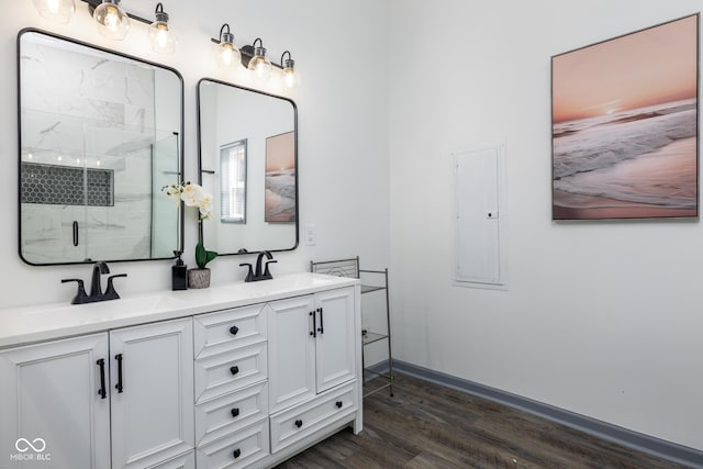 2221 E Michigan St, Indianapolis, IN 46201 - bathroom with a marble finish shower, a sink, double vanity, and wood finished floors