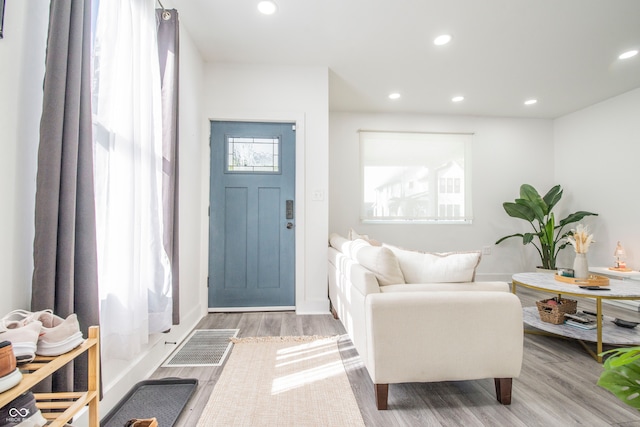 foyer entrance with light wood-type flooring