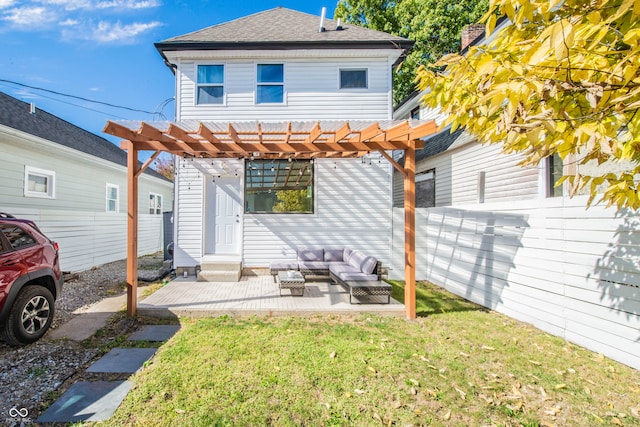 back of property with a patio, an outdoor hangout area, a lawn, and a pergola