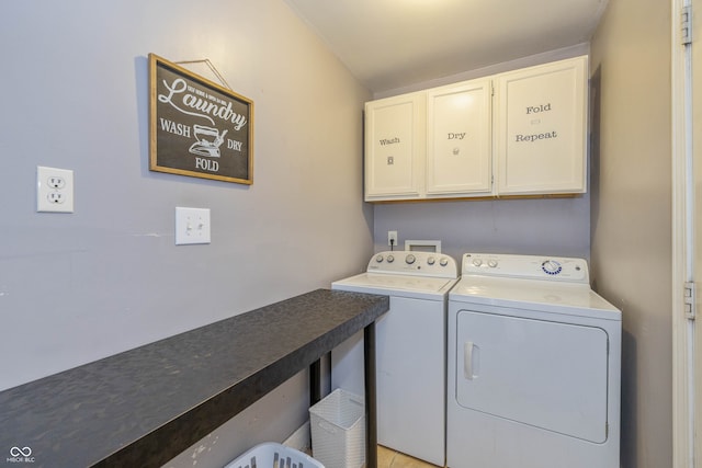 laundry area featuring cabinets, washing machine and dryer, and light tile patterned floors