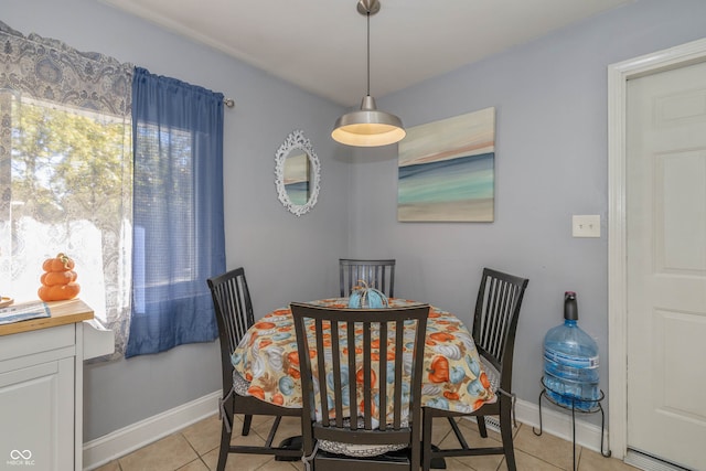 dining space with light tile patterned floors