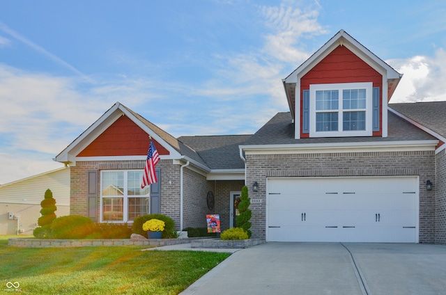 view of front of property with a front yard and a garage