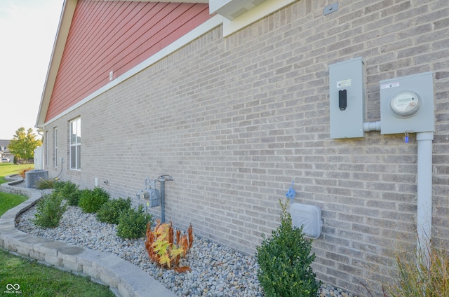 view of side of home featuring cooling unit