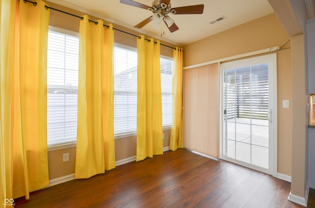 empty room featuring dark hardwood / wood-style floors and ceiling fan