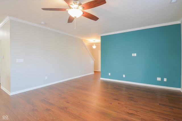 empty room featuring ceiling fan, dark hardwood / wood-style flooring, and crown molding