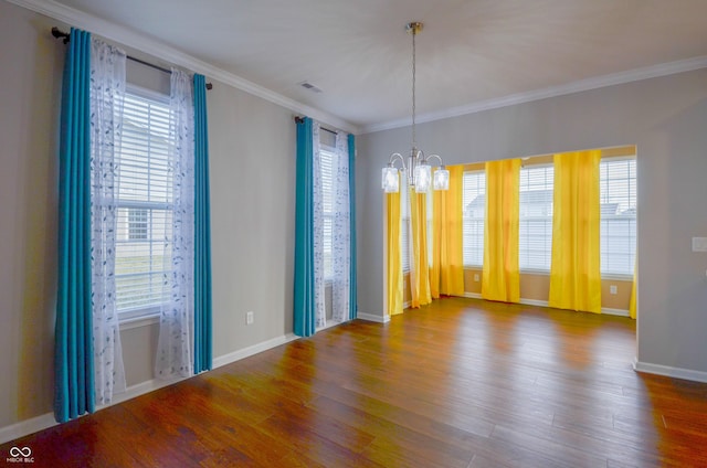 unfurnished room with a healthy amount of sunlight and hardwood / wood-style flooring