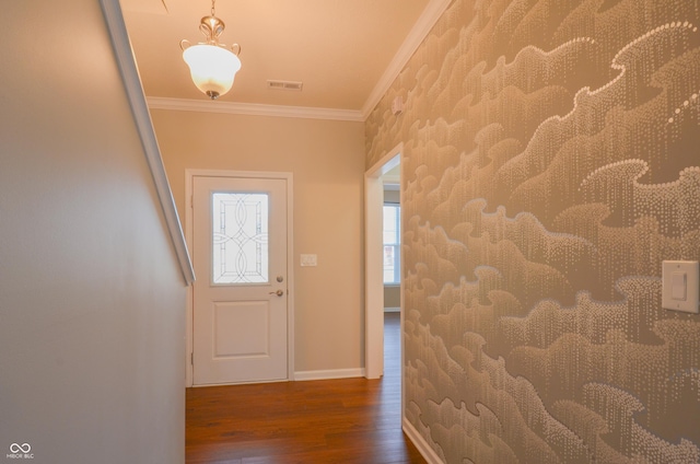 entryway with dark hardwood / wood-style floors and ornamental molding