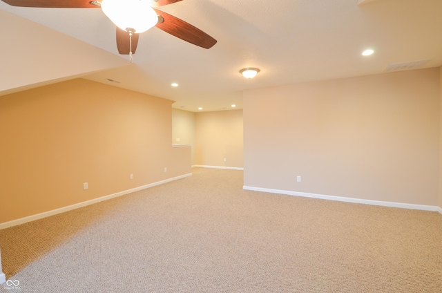 carpeted empty room with ceiling fan