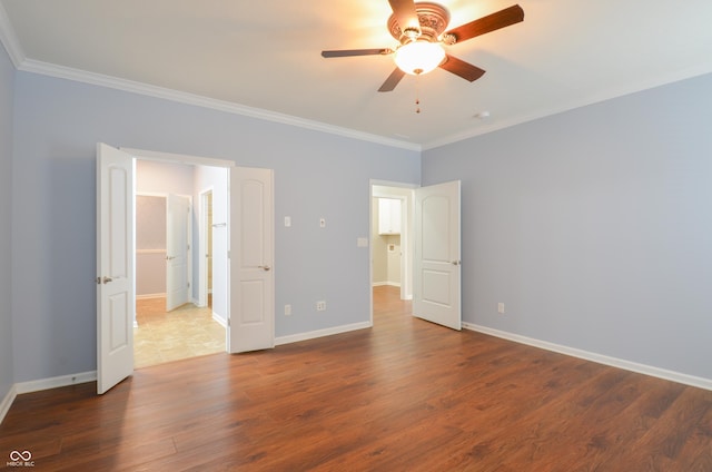 unfurnished bedroom with ceiling fan, ornamental molding, and dark wood-type flooring