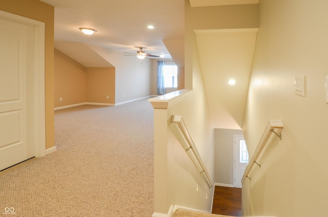 interior space with ceiling fan and carpet floors