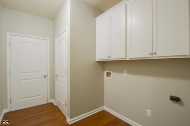 washroom featuring cabinets, washer hookup, and dark hardwood / wood-style floors