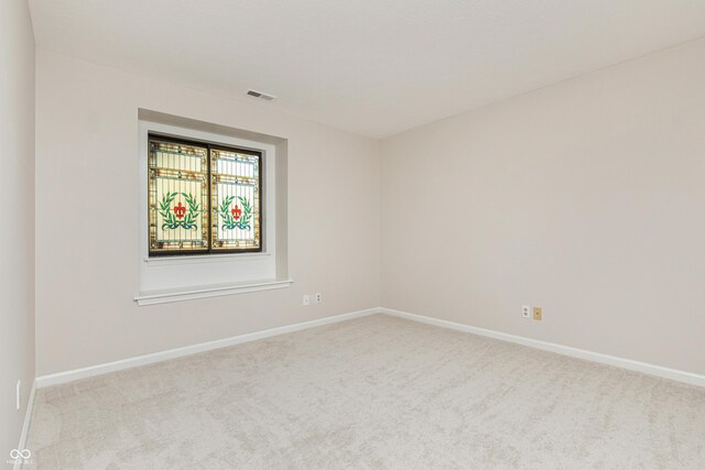 8168 Shorewalk Dr Unit A, Indianapolis, IN 46236 - spare room featuring carpet floors, baseboards, and visible vents