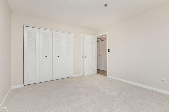 8168 Shorewalk Dr Unit A, Indianapolis, IN 46236 - unfurnished bedroom with carpet flooring, baseboards, and a closet