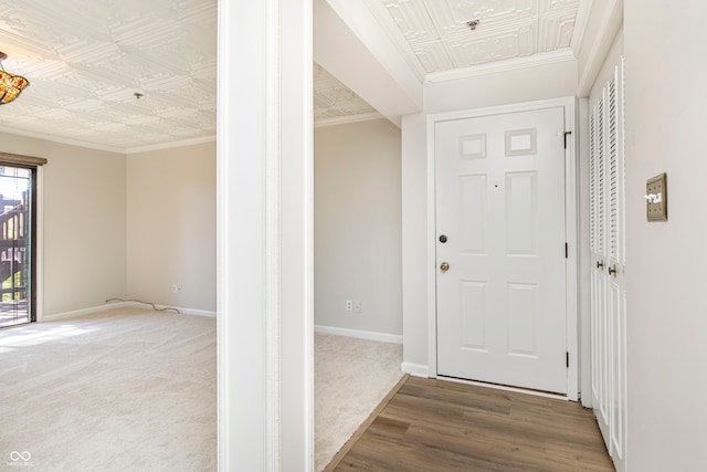 entrance foyer featuring hardwood / wood-style flooring and ornamental molding