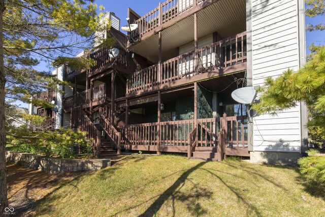 8168 Shorewalk Dr Unit A, Indianapolis, IN 46236 - rear view of house featuring a yard and a wooden deck