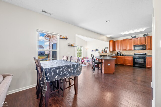 dining room featuring dark hardwood / wood-style flooring