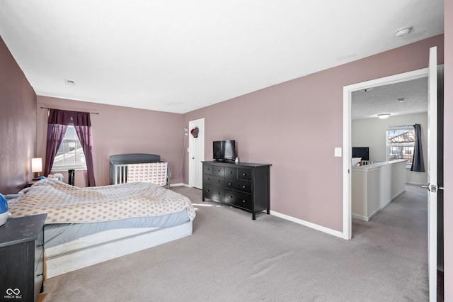 bedroom featuring light carpet