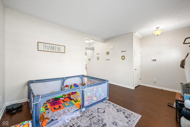 recreation room featuring dark hardwood / wood-style floors