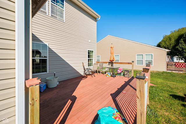 deck featuring a lawn