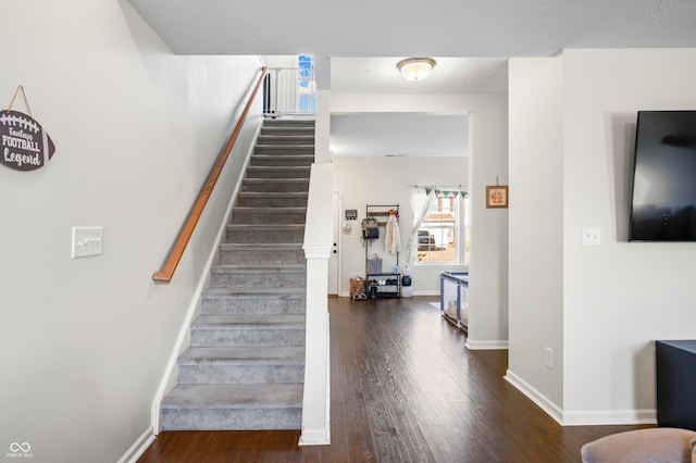 staircase featuring hardwood / wood-style floors