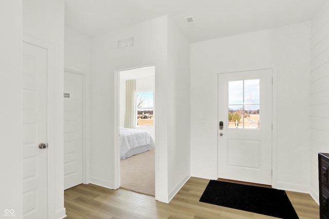 foyer entrance featuring light wood-type flooring