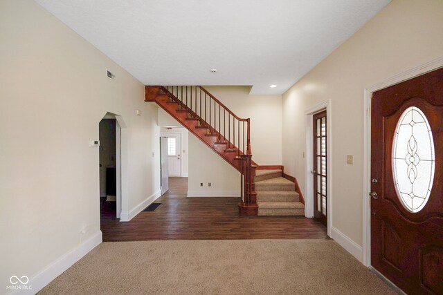 view of carpeted entrance foyer