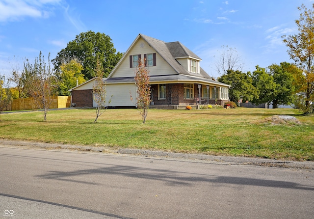 view of front of home featuring a front lawn and a porch