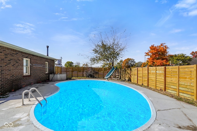 view of pool featuring a water slide