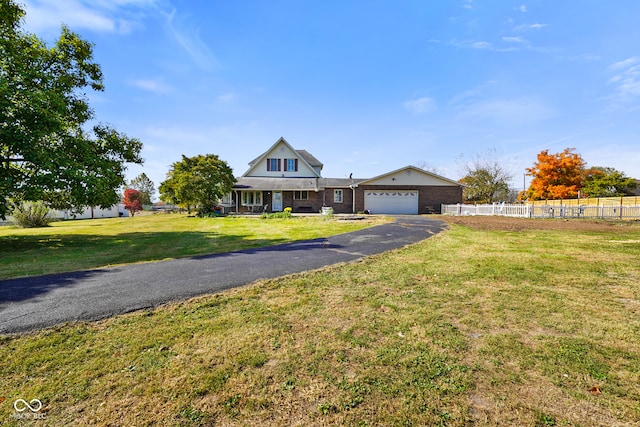 view of front facade with a front yard and a garage