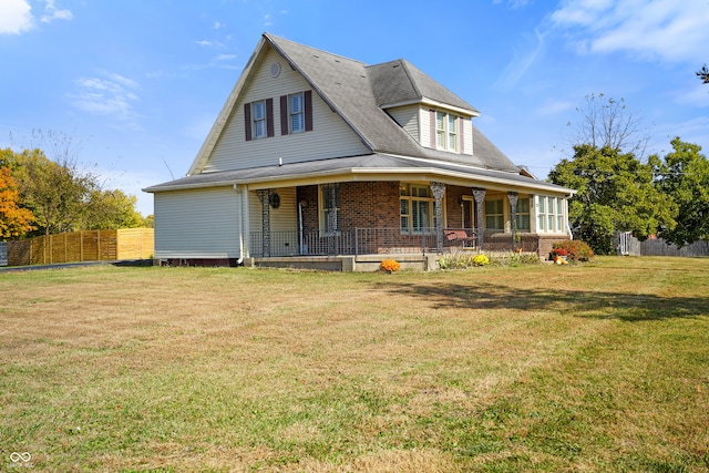 view of front of property featuring a front lawn and a porch