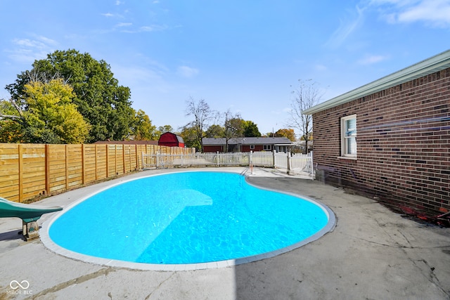 view of pool featuring a water slide