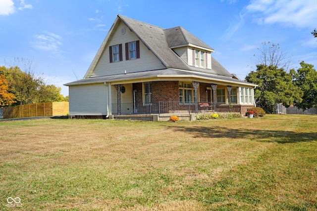 farmhouse-style home with a porch and a front yard