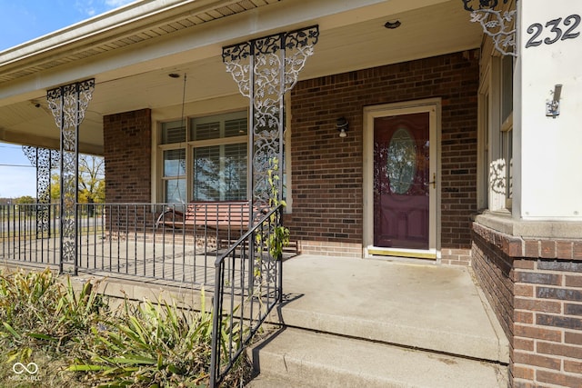 entrance to property featuring a porch