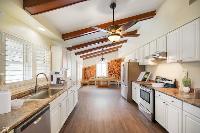 kitchen with lofted ceiling with beams, sink, dark wood-type flooring, appliances with stainless steel finishes, and white cabinets