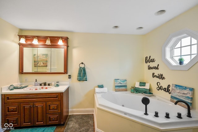 232 N Church St, Morgantown, IN 46160 - bathroom with a whirlpool tub, vanity, and baseboards