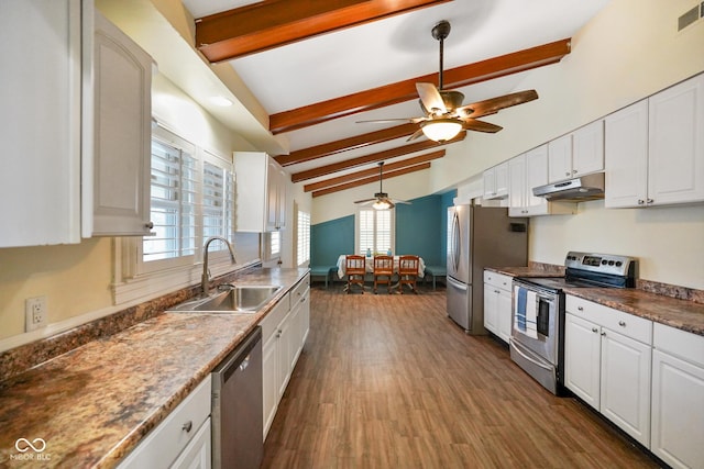 232 N Church St, Morgantown, IN 46160 - kitchen with white cabinets, under cabinet range hood, vaulted ceiling with beams, a sink, and appliances with stainless steel finishes